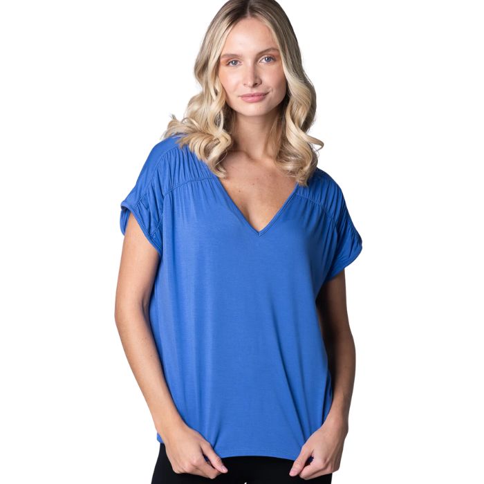 top of female model wearing ocean blue alicia v-neck top front view on white background