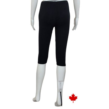 bottom of white mannequin wearing black elle 3/4 length leggings back view on white background