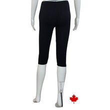 bottom of white mannequin wearing black elle 3/4 length leggings back view on white background