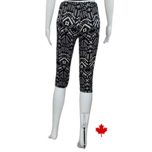 bottom of white mannequin wearing geometric print elle 3/4 length leggings back view on white background