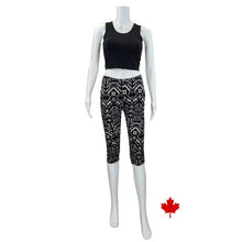 white mannequin wearing geometric print elle 3/4 length leggings and stephanie crop tank top front view on white background