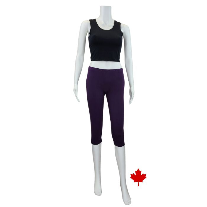white mannequin wearing plum purple elle 3/4 length leggings and black stephanie crop tank top front view on white background