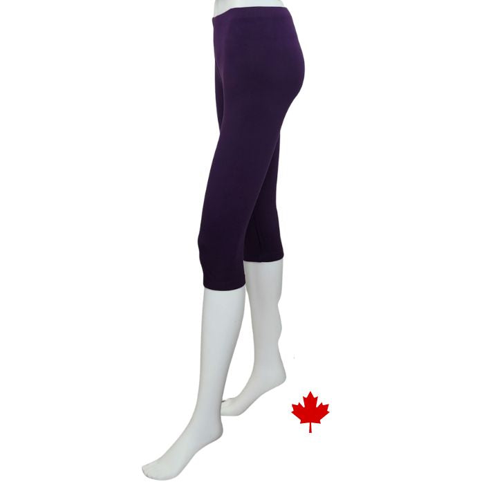 bottom of white mannequin wearing plum purple elle 3/4 length leggings side view on white background