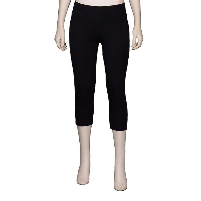 bottom of white mannequin wearing black eve yoga 3/4 length leggings front view on white background