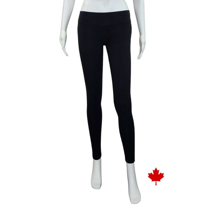 bottom of white mannequin wearing black eve full length leggings front view on white background