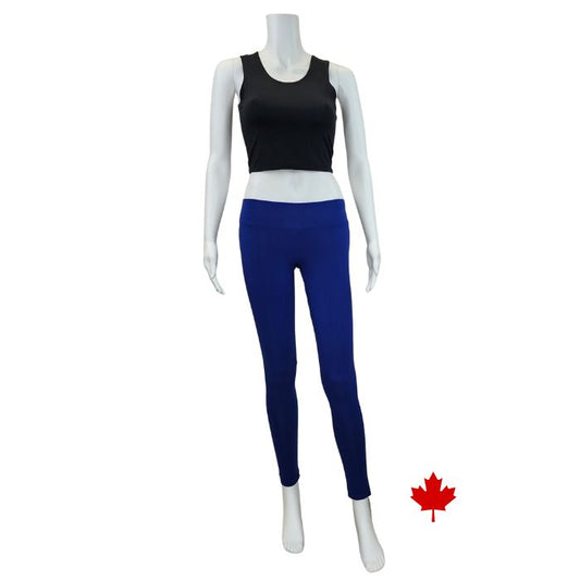 white mannequin wearing indigo blue eve full length leggings and black stephanie crop tank top front view on white background