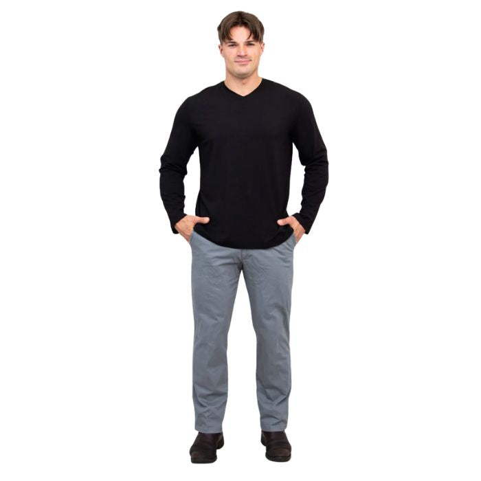 male model wearing black adam long sleeve shirt and grey pants front view on white background