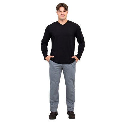 male model wearing black adam long sleeve shirt and grey pants front view on white background