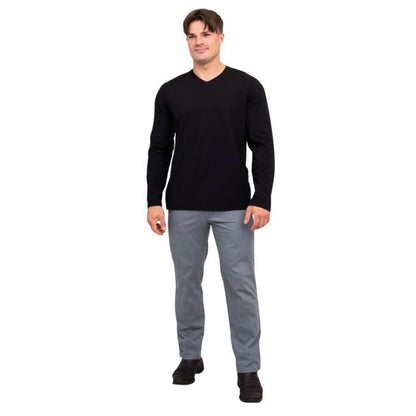 male model wearing black adam long sleeve shirt and grey pants front view on white background
