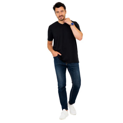 male model wearing black adam short sleeve shirt and blue jeans front view on white background