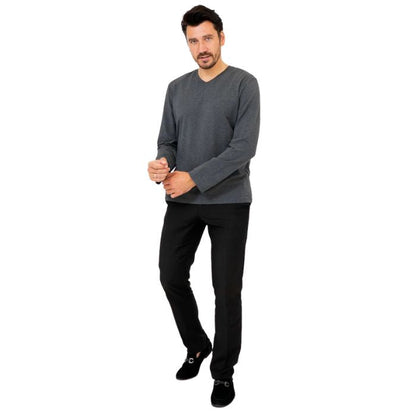 male model wearing graphite grey adam long sleeve shirt and black pants front view on white background