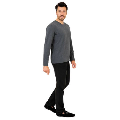 male model wearing graphite grey adam long sleeve shirt and black pants side view on white background