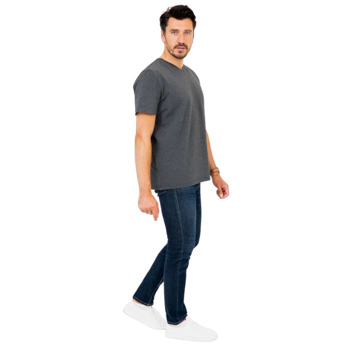 male model wearing graphite grey adam short sleeve shirt and blue jeans side view on white background