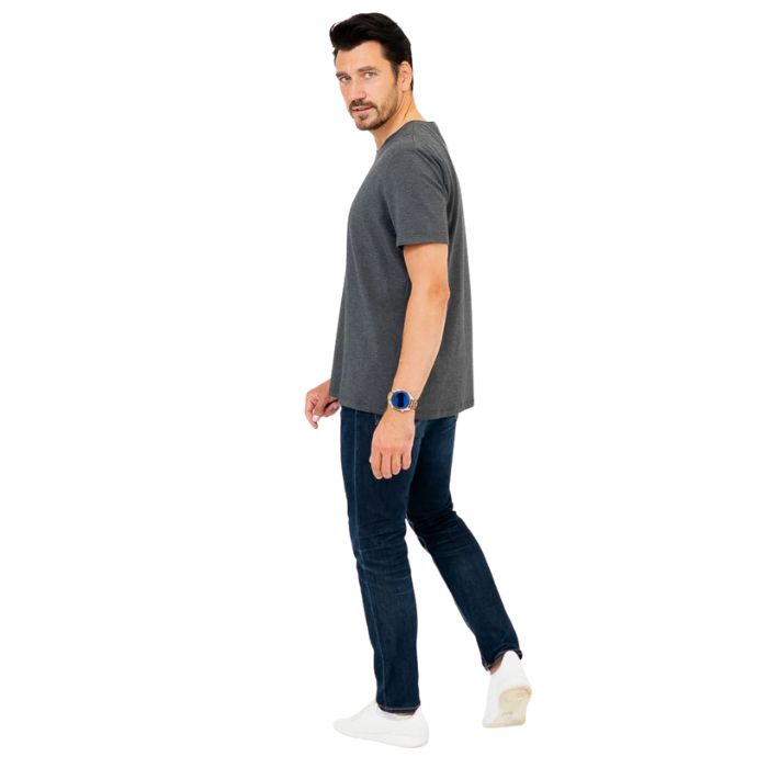 male model wearing graphite grey adam short sleeve shirt and blue jeans side view on white background