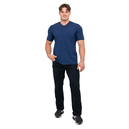 male model wearing indigo blue adam short sleeve shirt and black pants front view on white background