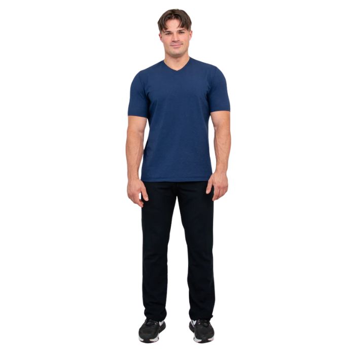 male model wearing indigo blue adam short sleeve shirt and black pants front view on white background