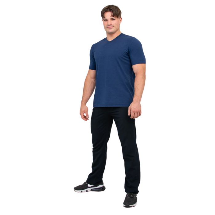 male model wearing indigo blue adam short sleeve shirt and black pants front view on white background