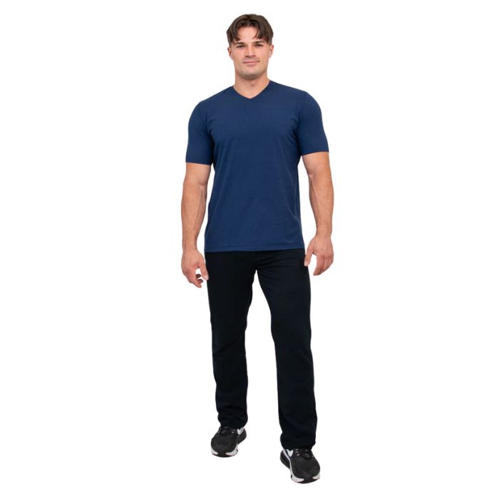 male model wearing indigo blue adam short sleeve shirt and black pants front view on white background
