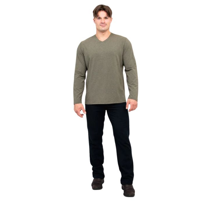 male model wearing khaki green adam long sleeve shirt and black pants front view on white background