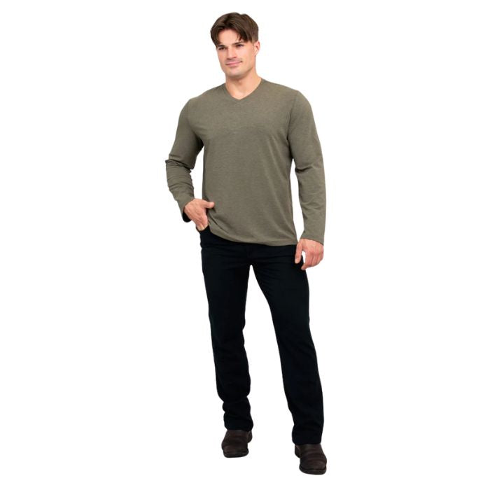 male model wearing khaki green adam long sleeve shirt and black pants front view on white background