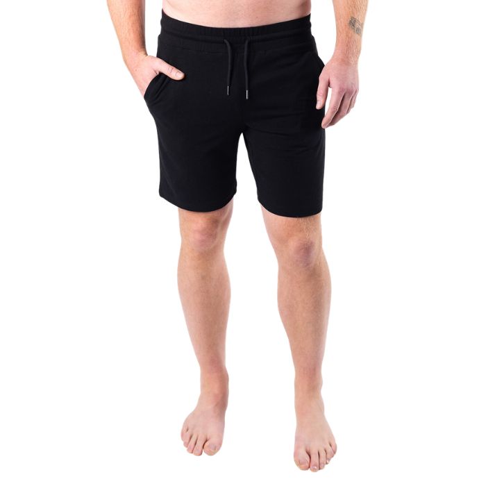 male model wearing black aspen shorts front view on white background