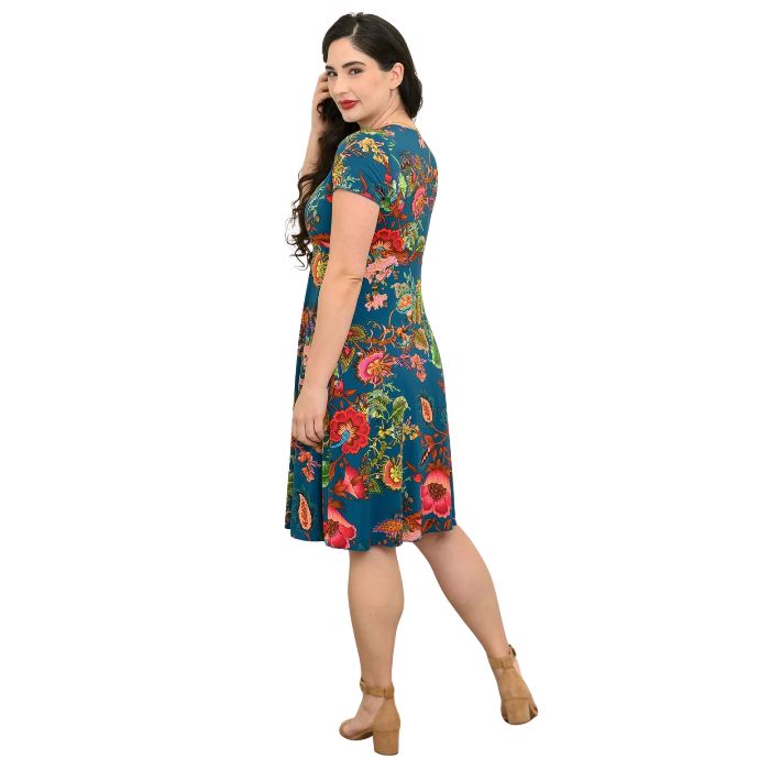 woman wearing teal fantasy print aurora dress back view set on a white background