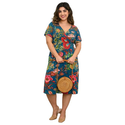 woman wearing teal fantasy print aurora dress front view set on a white background