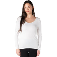 top of female model wearing white aurora long sleeve top front view on white background