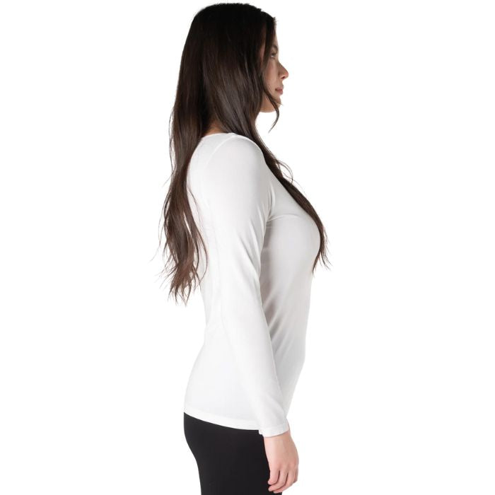 top of female model wearing white aurora long sleeve top side view on white background