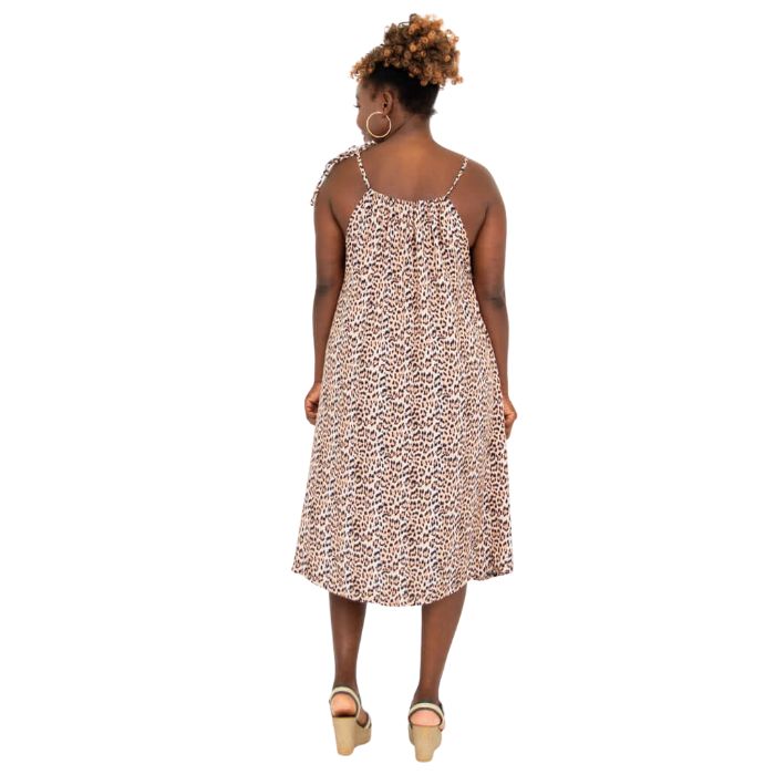 woman wearing leopard print beach dress back view set on a white background