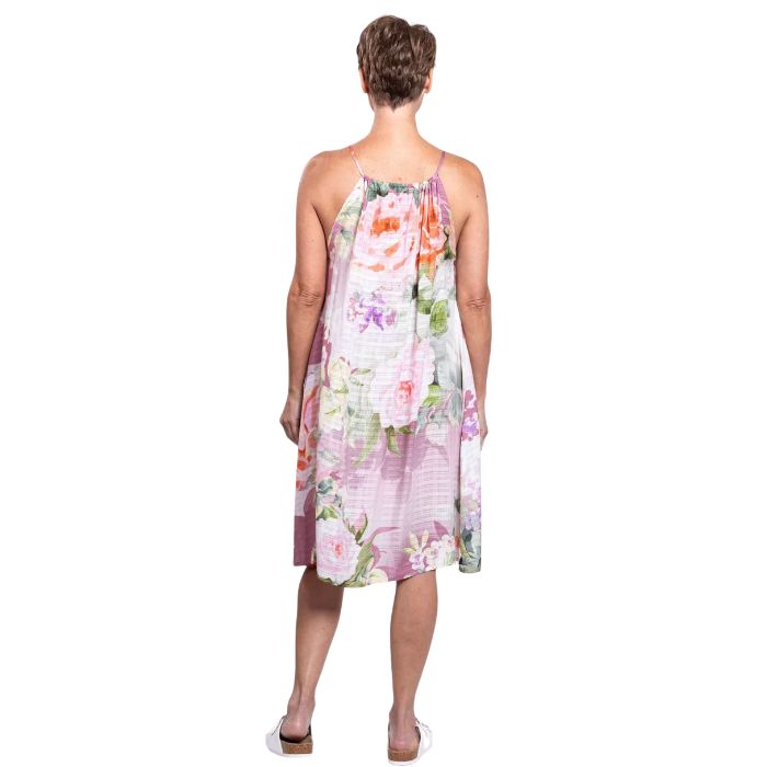 woman wearing pasina print beach dress back view set on a white background