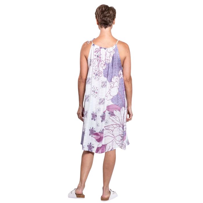 woman wearing reina print beach dress back view set on a white background