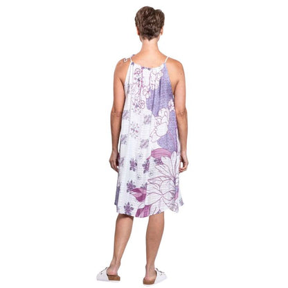 woman wearing reina print beach dress back view set on a white background