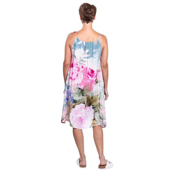 woman wearing rosa print beach dress front view set on a white background