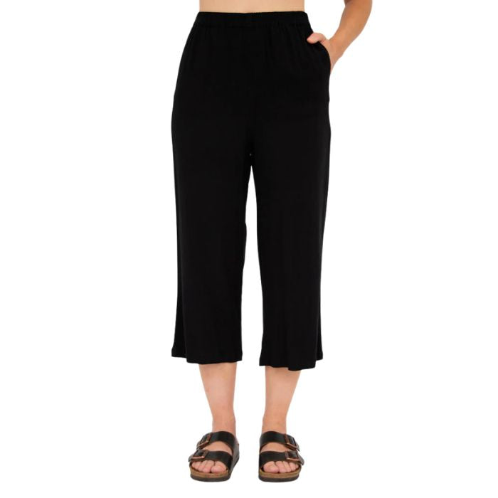 female model wearing black bella capri pants front view on white background