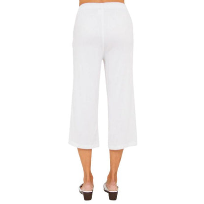 female model wearing white bella capri pants back view on white background