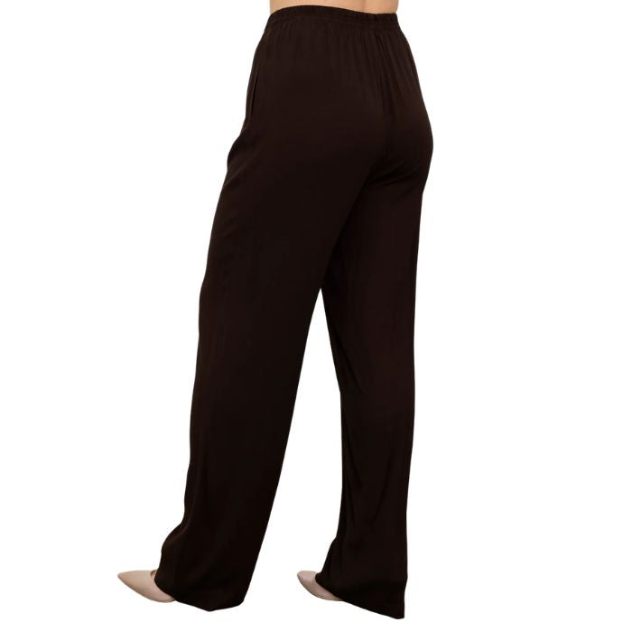 female model wearing chocolate brown bella pants back view on white background