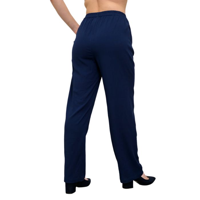 female model wearing indigo blue bella pants back view on white background