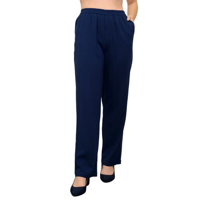 female model wearing indigo blue bella pants front view on white background