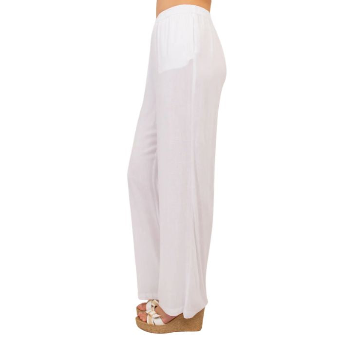 female model wearing white bella pants side view on white background
