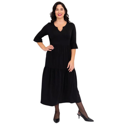 female model wearing black bernadette dress front view on white background