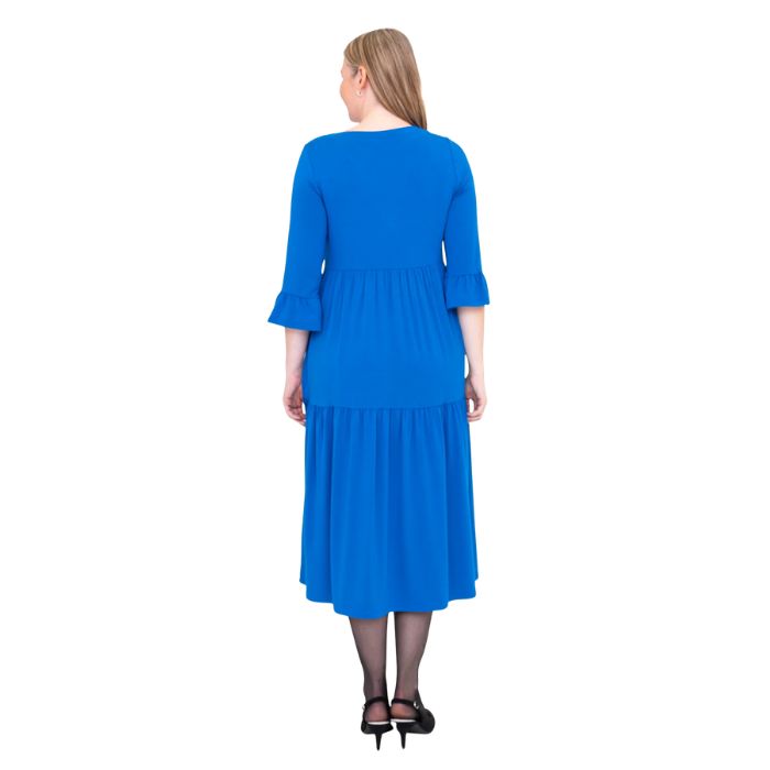 female model wearing cobalt blue bernadette dress back view on white background