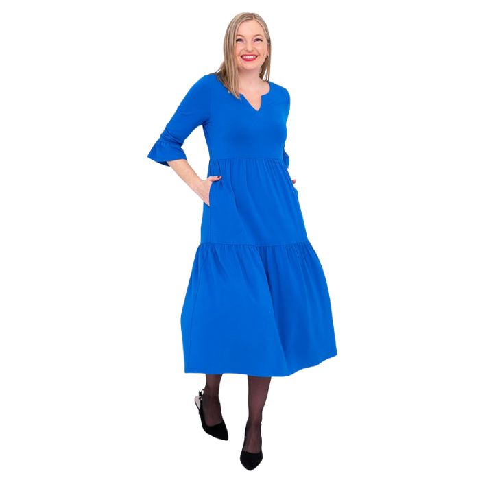 female model wearing cobalt blue bernadette dress front view on white background