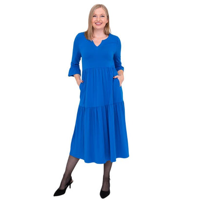 female model wearing cobalt blue bernadette dress front view on white background