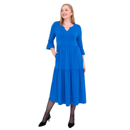 female model wearing cobalt blue bernadette dress front view on white background