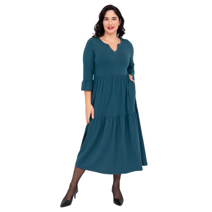 female model wearing teal green bernadette dress front view on white background