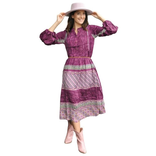 female model wearing blue bayou dress mixed prints front view on white background