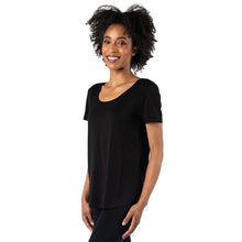 top of female model wearing black brenda u-neck tee side view on white bacground