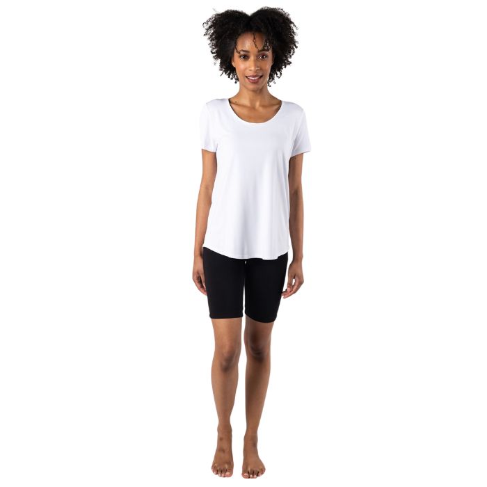 female model wearing white brenda u-neck tee and terrera black essential shorts front view on white bacground
