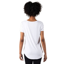 top of female model wearing white brenda u-neck tee back view on white bacground